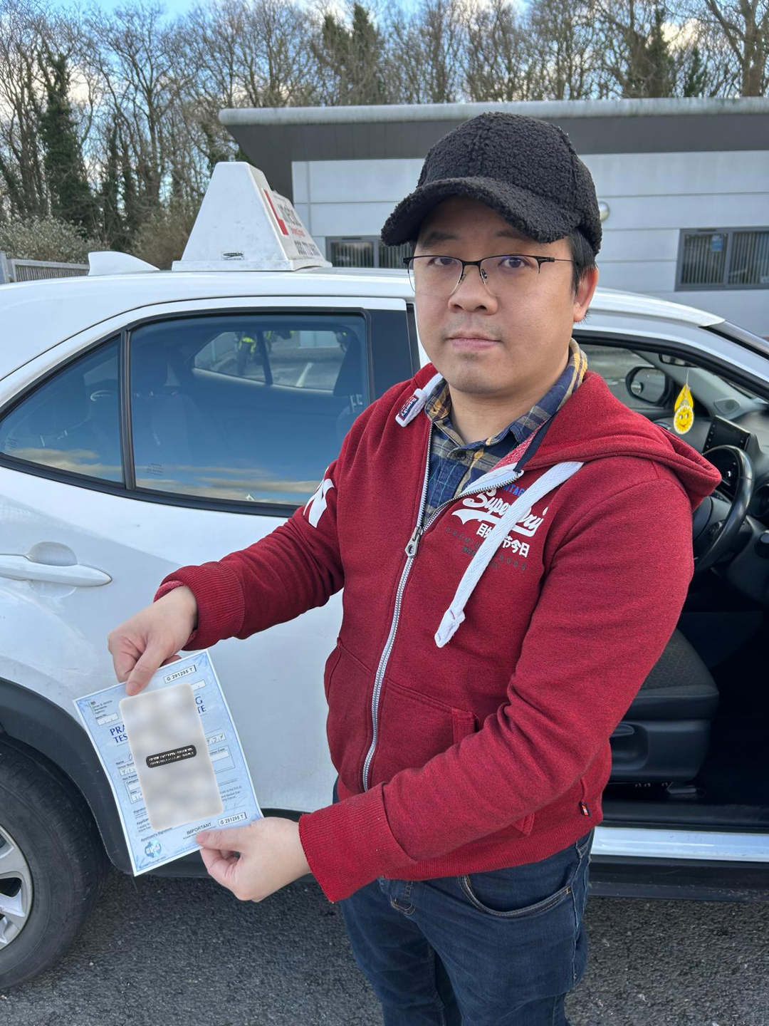 A learner holding a privacy-protected practical driving test certificate